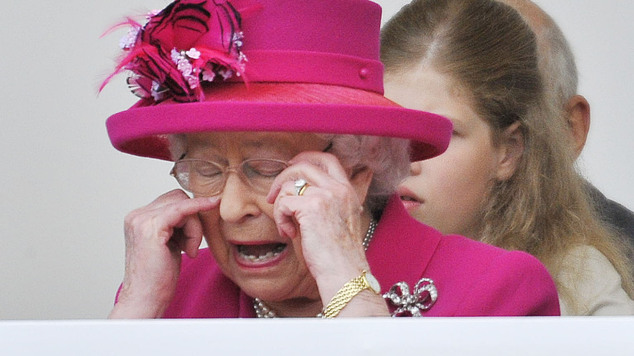 Queen Elizabeth watches the parade along The Mall